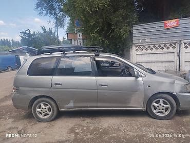 suzuki wagon: Минивэн серого цвета с багажной системой на крыше. - Кузов: 5‑дверный — 1