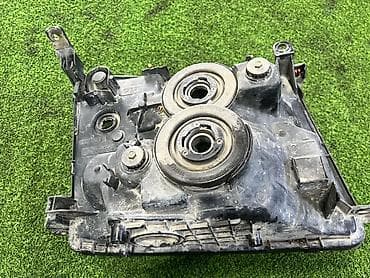 грузовики ош: Левая передняя фара Тойота Ленд круизер 105 (до рест) Оригинал — 3