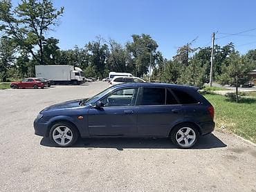 bad e2: Mazda 323: 2003 г., 1.6 л, Механика, Газ, Универсал — 3