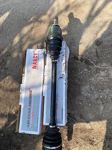 Передний амортизатор Subaru 2001 г., Б/у, Аналог — 1