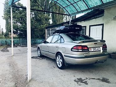 дамкрат авто: Mazda Capella: 1998 г., 2 л, Автомат, Бензин, Седан — 6