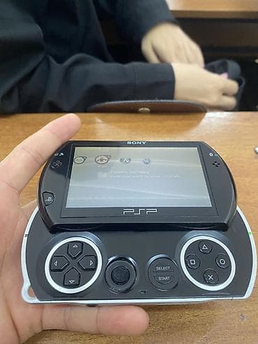 ps camera: Sony PSP Go (N1000) — портативная игровая консоль с выдвижным — 1