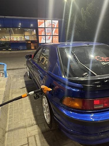 colf 2: Mazda Familia: 1992 г., Бензин, Хэтчбэк — 5