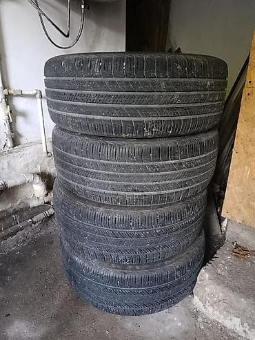 Комплект из 4 летних шин 235/55 R19. Характеристики: - Размер: 235/55