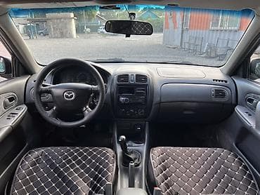 e 303: Mazda 323: 1999 г., 1.6 л, Механика, Бензин, Универсал — 6