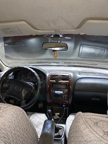 Унаа: Mazda 626: 1999 г., 1.8 л, Кол менен иштөөчү, Бензин, Седан — 7