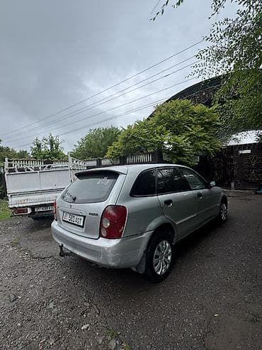 коробка опель вектра б: Mazda Familia: 2002 г., 1.3 л, Бензин, Универсал — 2