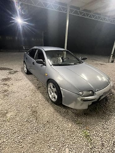 прес ош: Mazda Lantis: 1996 г., 1.5 л, Механика, Бензин, Седан — 1