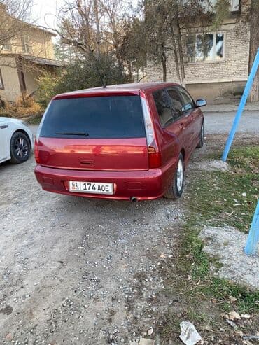 дом на калесох: Mitsubishi Lancer: 2003 г., 1.6 л, Механика, Бензиновая, Универсал — 3