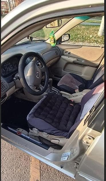 авто крепеж: Mazda Protege: 2001 г., Автомат, Бензин, Седан — 4