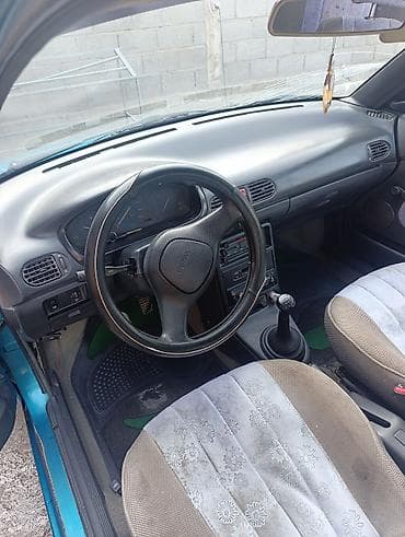 smart car: Mazda 121: 1991 г., 1.3 л, Механика, Бензин, Седан — 7