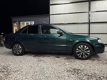 е34 люк: Mazda 323: 2000 г., 1.3 л, Механика, Бензин, Седан — 6