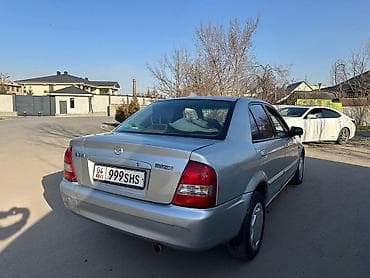 продаю автомобили: Mazda 323: 2002 г., 1.6 л, Механика, Бензин, Седан — 1
