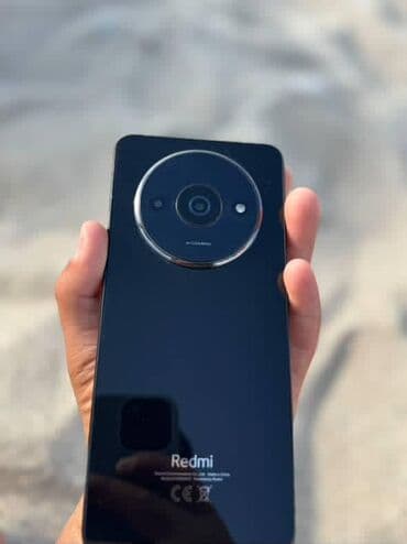 плазма тв: Смартфон Redmi черного цвета с глянцевой задней панелью. Оснащен — 3