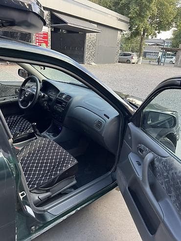 e 303: Mazda 323: 1999 г., 1.6 л, Механика, Бензин, Универсал — 7