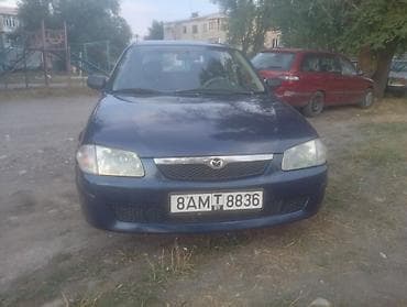e klass: Mazda 323: 2000 г., Механика, Бензин — 1