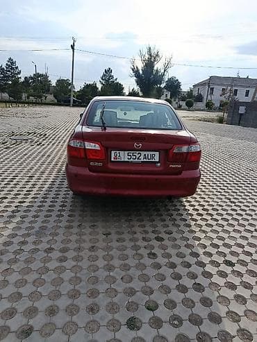 down pipe: Mazda 626: 2000 г., 2 л, Механика, Бензин, Хэтчбэк — 4