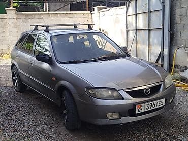 Mazda 323: 2002 г., Механика, Бензин, Универсал