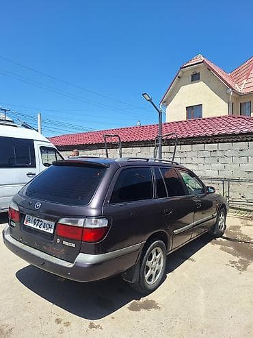 глушитель выхлоп: Mazda 626: 1999 г., 1.8 л, Механика, Бензин, Универсал — 1