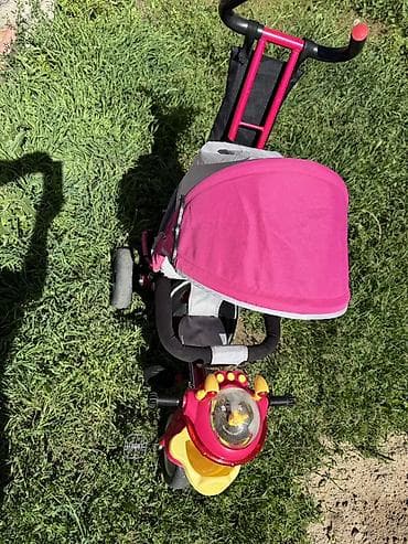 Детский трехколесный велосипед с родительской ручкой и козырьком