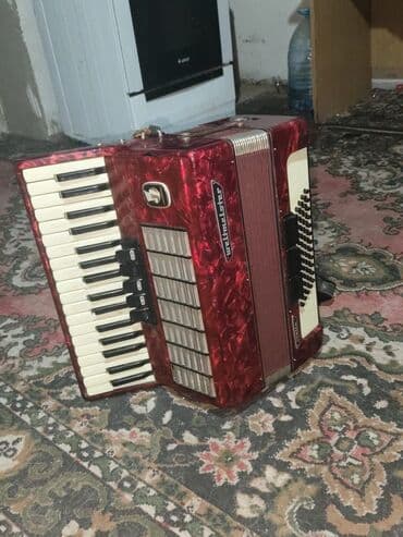 купить бу аккордеон: Аккордеон Weltmeister (Германия), красный перламутровый корпус — 1