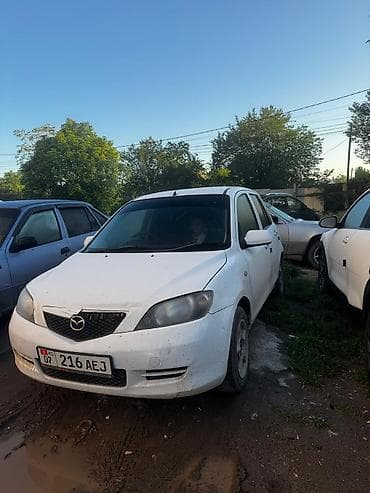 mini v: Mazda Demio: 2004 г., 1.3 л, Автомат, Бензин, Седан — 9