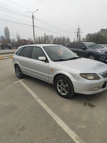 Ламинат: Mazda 323: 2002 г., 1.5 л, Автомат, Бензин, Универсал — 7