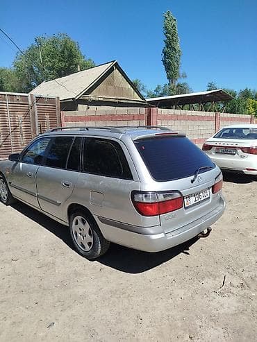 глушитель на макси: Mazda 626: 1998 г., 1.8 л, Механика, Бензин, Универсал — 7