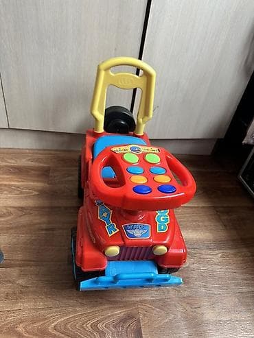 Детская каталка-машинка с музыкальной панелью. - Яркий корпус