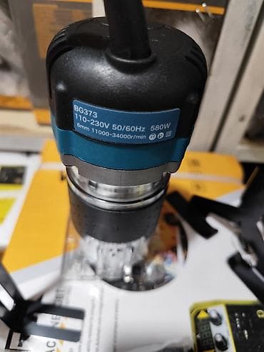 Строительное оборудование: Компактный ручной кромочный фрезер Makita BG373 - Мощность: 580 Вт - — 4
