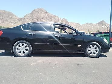 corolla s: Nissan Teana I (J31), черный седан бизнес-класса. Основные — 5