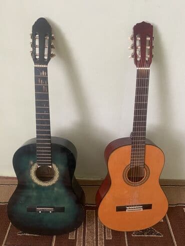 спортивное оборудование: Акустическая гитара классического стиля, представленная в двух — 1