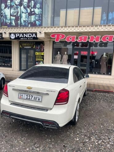 как можно купить машину в рассрочку: Автомобиль Chevrolet Gentra, элегантный седан белого цвета. Эта модель — 6