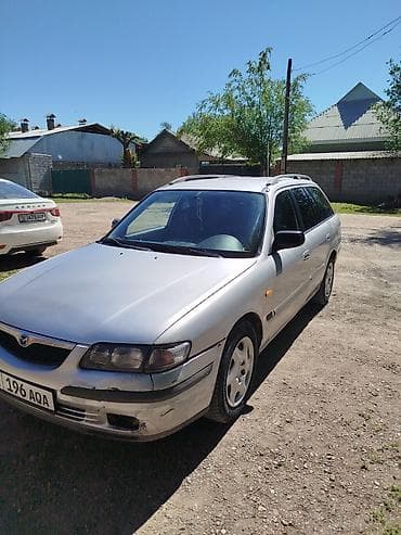 глушитель на макси: Mazda 626: 1998 г., 1.8 л, Механика, Бензин, Универсал — 1