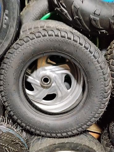 балон 14 ош: Колесо в сборе для скутера/мопеда. Характеристики: - Размер покрышки — 1