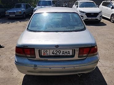 колпачки: Mazda Cronos: 1992 г., 2 л, Механика, Бензин, Седан — 6