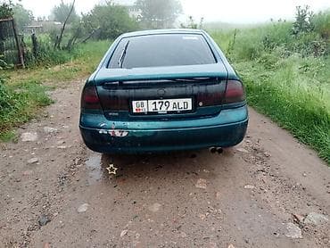 капот солярис: Mazda 626: 1992 г., Седан — 2