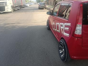 лифтбек: Daihatsu Cuore: 2004 г., 1 л, Механика, Бензин, Лифтбек — 5