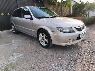 Mazda 323: 2003 г., 2 л, Кол менен иштөөчү, Газ, Хетчбек — 9