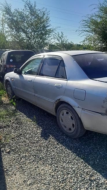 mazda 626 кронос: Mazda Familia: 2002 г., 1.6 л, Автомат, Бензин, Седан — 1