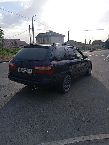 Транспорт: Mazda Capella: 2000 г., Механика, Универсал — 5