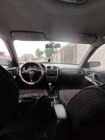 e2 byd: Mazda 323: 2002 г., 1.6 л, Механика, Бензин, Хэтчбэк — 9