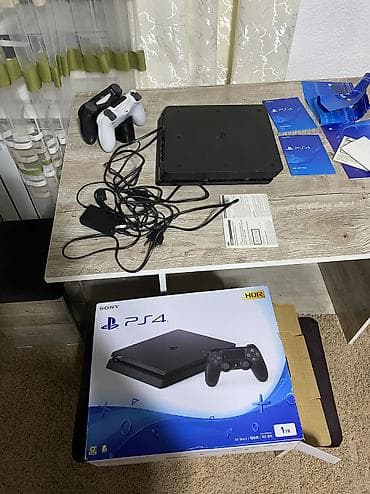 цена на плейстейшен 4: Sony PlayStation 4 Slim (PS4) — версия на 1 ТБ, цвет Jet Black (HDR) — 5