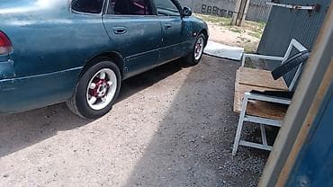 Mazda 323: 1994 г., 1.8 л, Механика, Бензин, Седан — 2