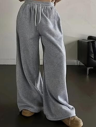 оранжевые штаны: Свободные спортивные штаны унисекс в меланжево-сером цвете. - — 3