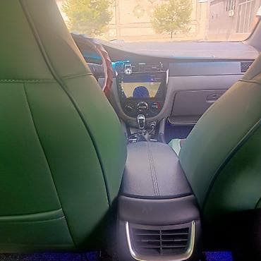 спарк капот: Daewoo Gentra: 2013 г., 1.5 л, Механика, Газ, Седан — 10