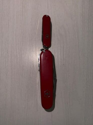 Музыкальные инструменты: Мультитулы и швейцарские ножи (набор) 1) Красный швейцарский нож — 4