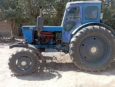 кун трактора: Трактор т40 колесный 4x4, синего цвета, с закрытой кабиной — 3