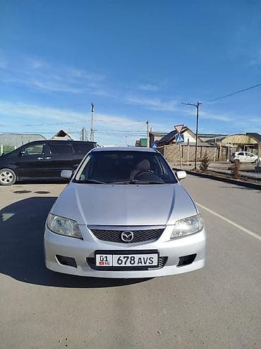Унаа: Mazda 323: 2001 г., 1.6 л, Кол менен иштөөчү, Бензин, Хетчбек — 2