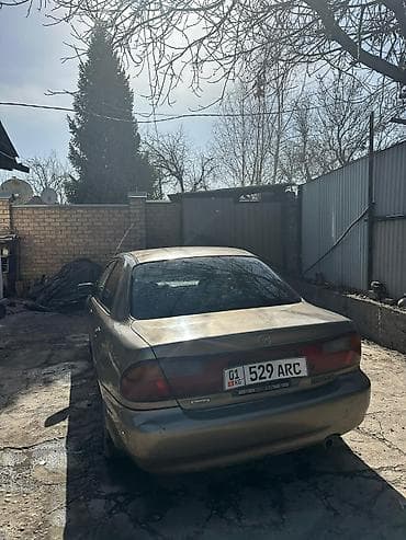 3c te: Mazda 323: 1998 г., 1.6 л, Автомат, Бензин, Седан — 8